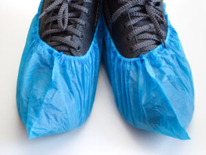 blue shoe covers over shoes