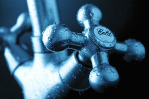 'Cold' faucet covered in condensation