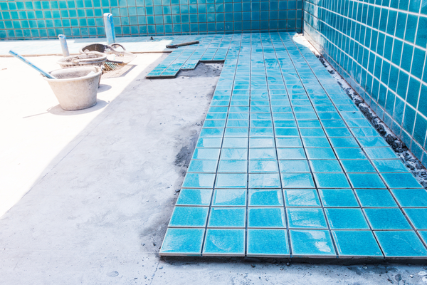 In-progress inground pool installation in the backyard of a Los Angeles home.