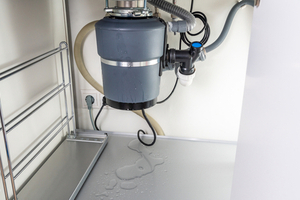 Garbage disposal leaking from either the side or bottom