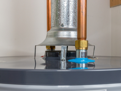 The flue vent on top of a gas water heater.