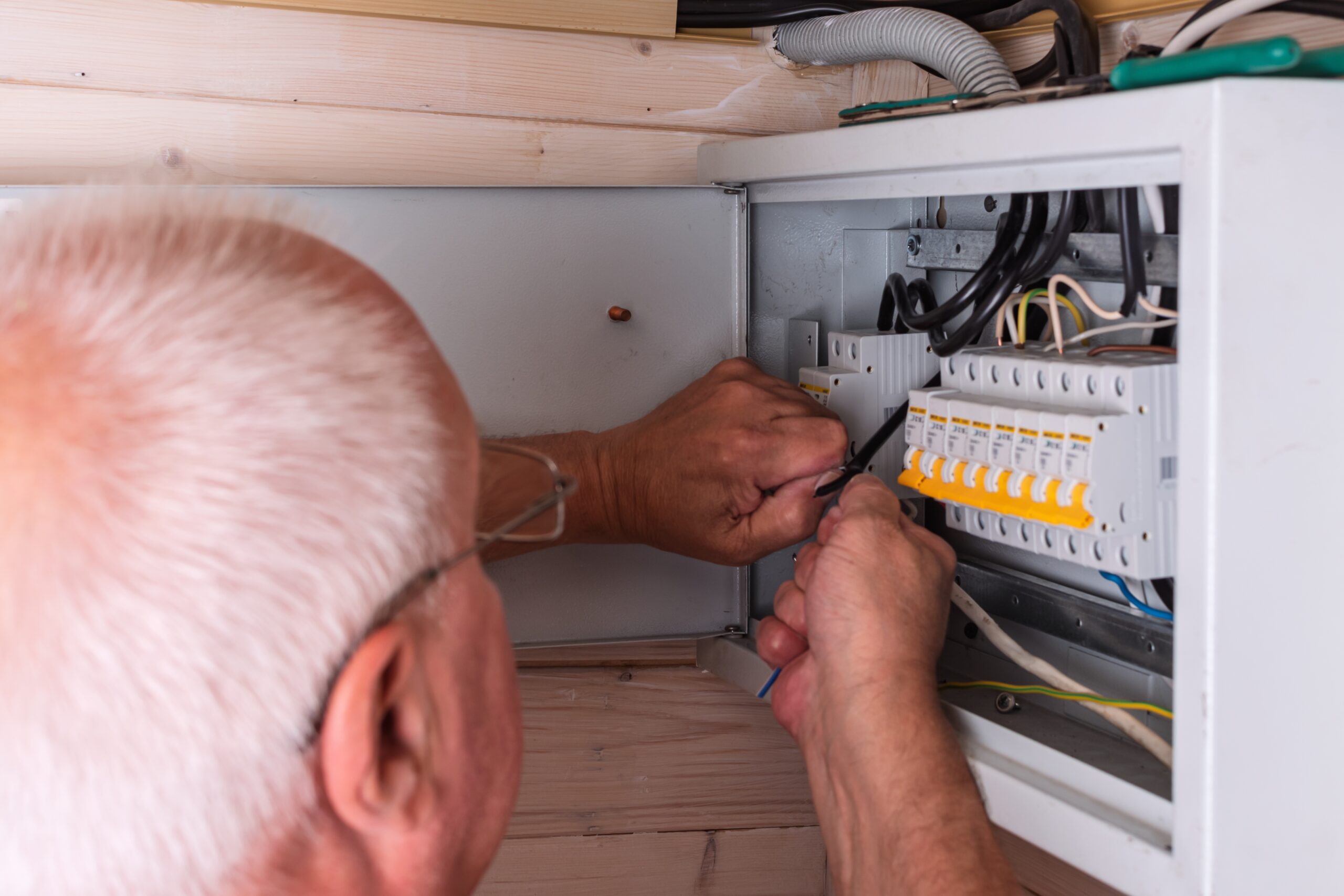 electrician upgrading panel showing when your system falls behind an electrical upgrade moves you forward